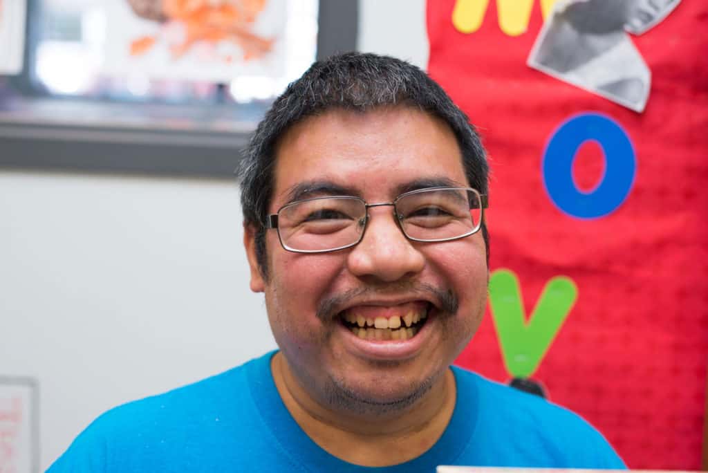 A man smiles at the camera.